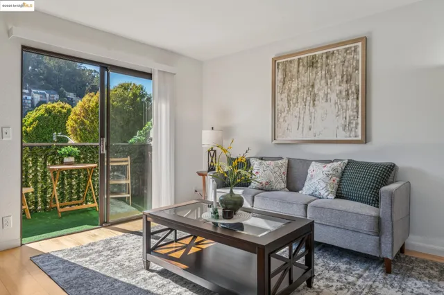 a living room with furniture and a table