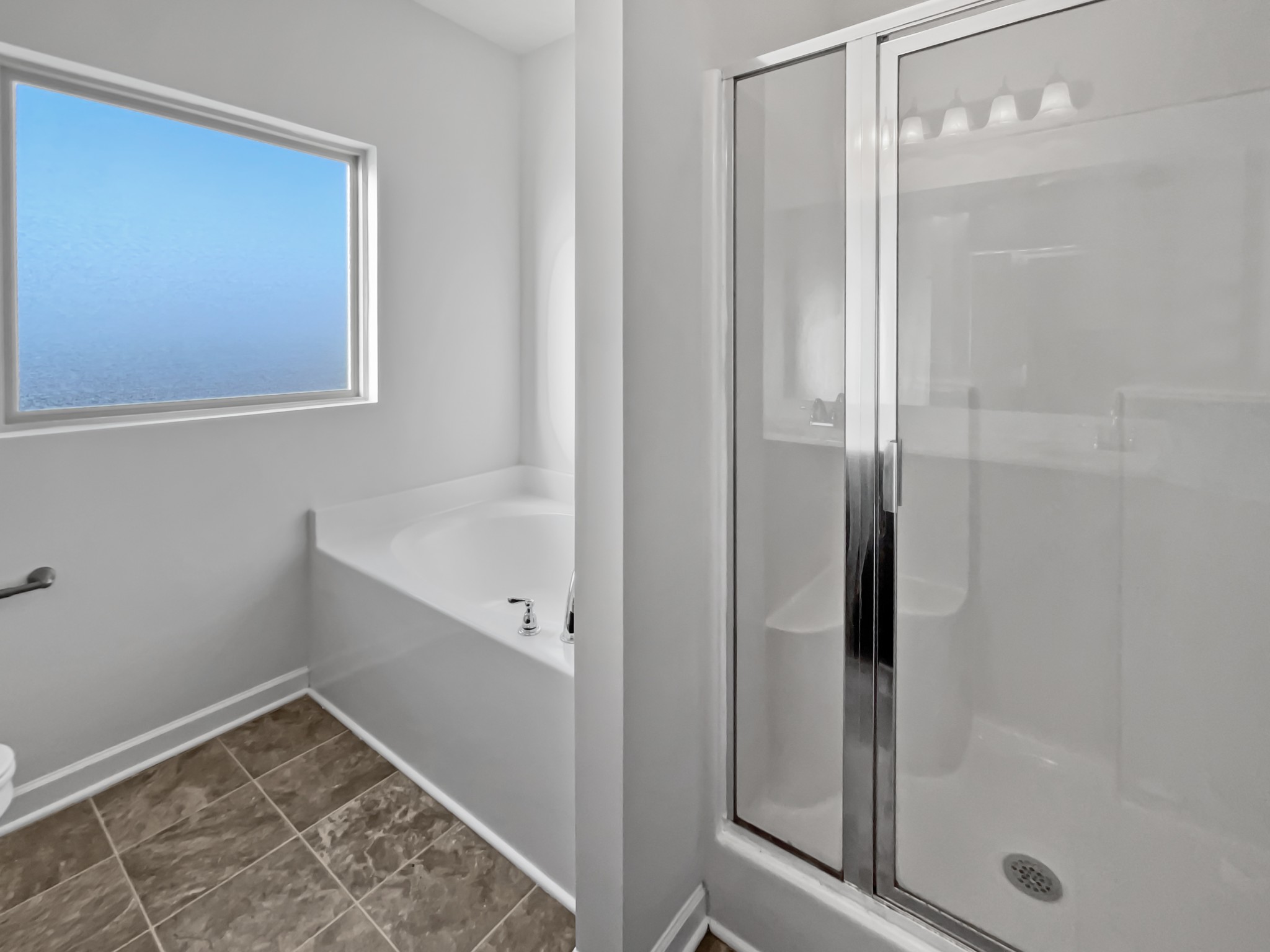 5020 Norman Way Spring Hill, TN 37174 - Photo 13 of 18 a bathroom with a bathtub and shower