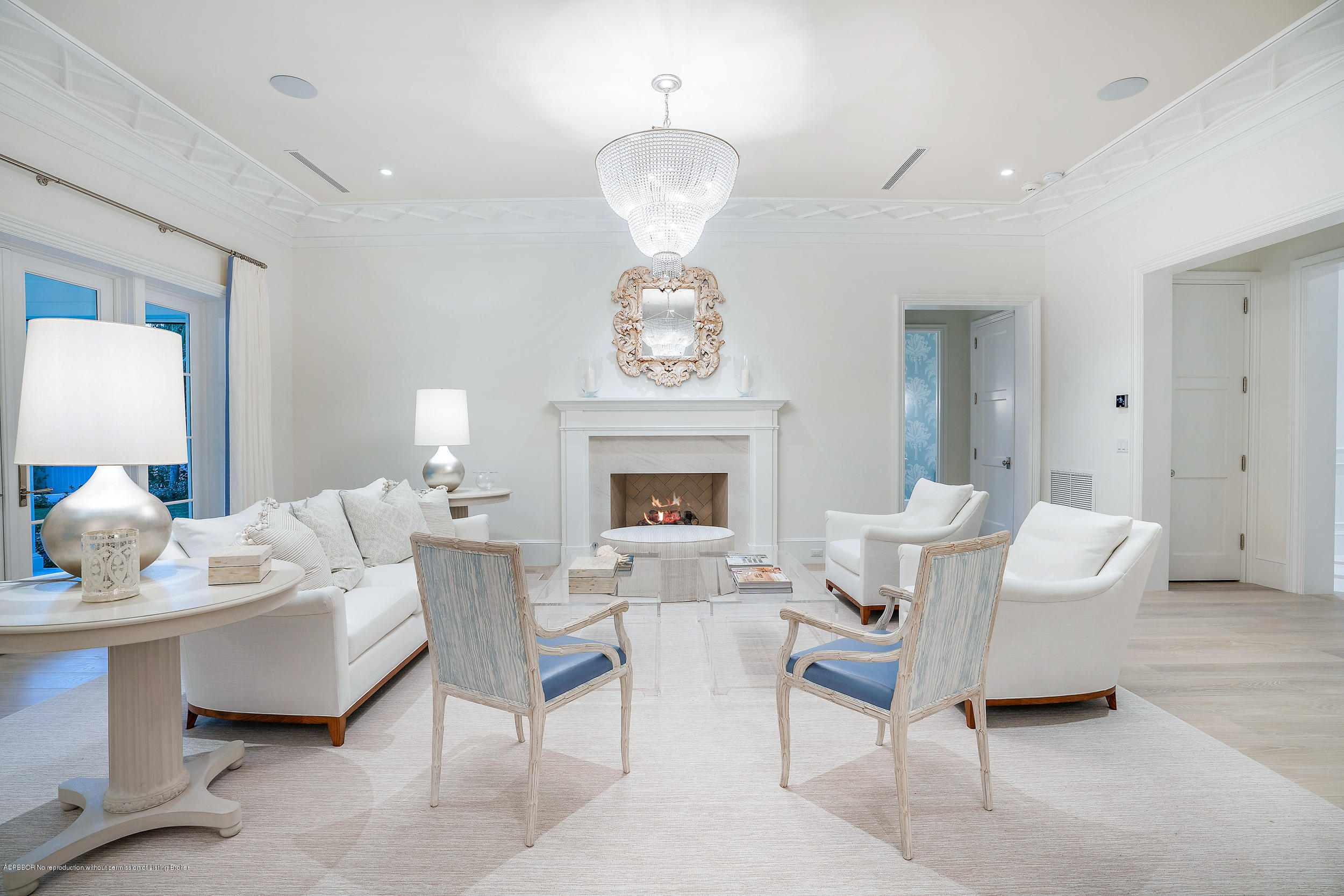 140 Kings Road Palm Beach, FL 33480 - Photo 13 of 42 a living room with furniture a fireplace and a chandelier