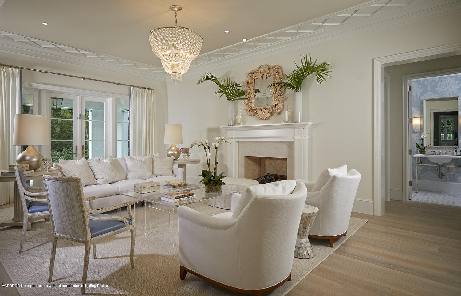 140 Kings Road Palm Beach, FL 33480 - Photo 14 of 42 a living room with furniture a chandelier and a fireplace