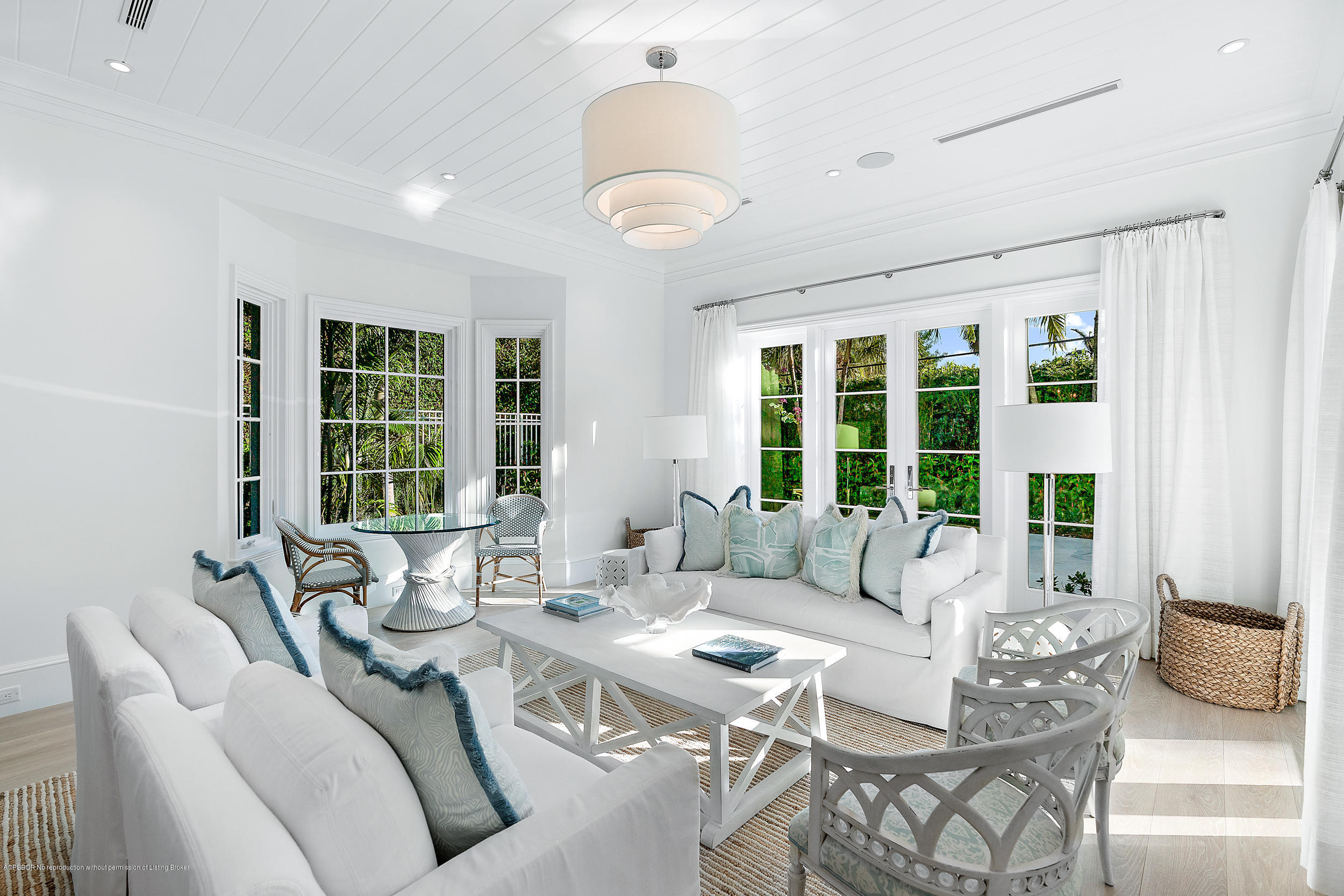 140 Kings Road Palm Beach, FL 33480 - Photo 16 of 42 a living room with furniture and large windows