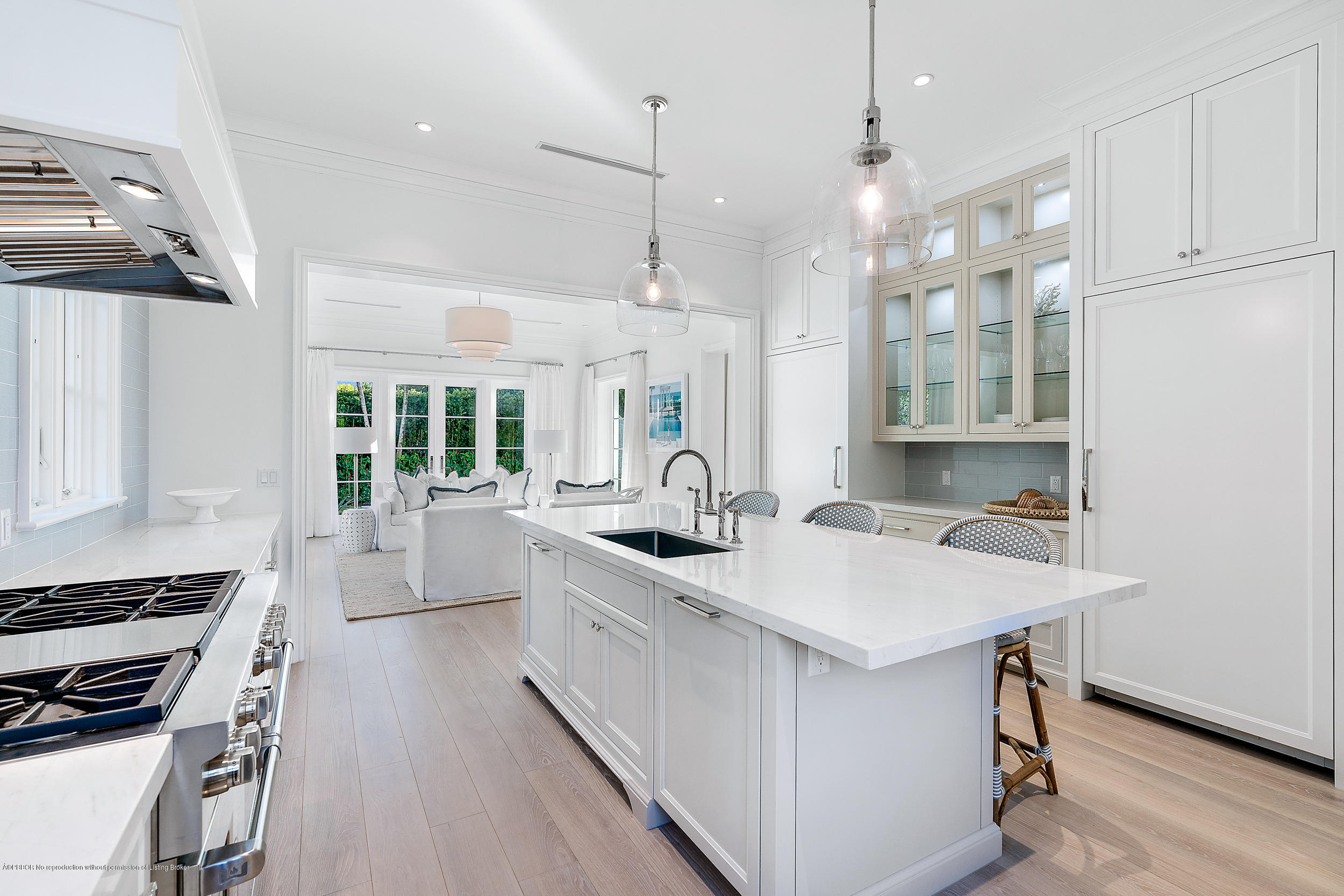 140 Kings Road Palm Beach, FL 33480 - Photo 19 of 42 a kitchen with white cabinets stove and sink