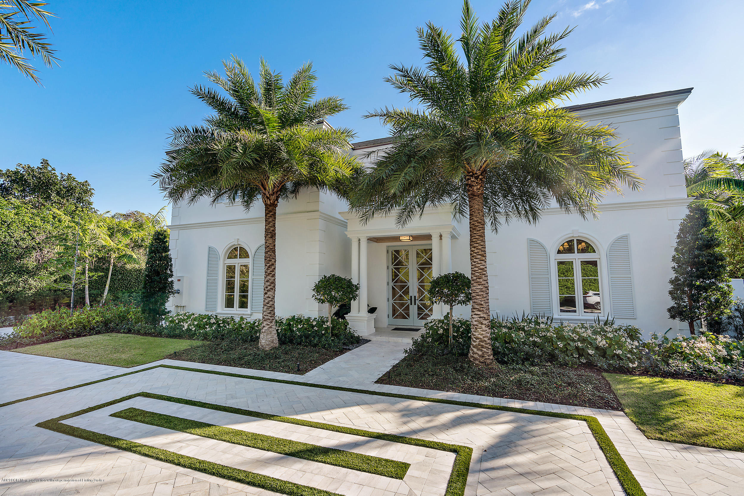 140 Kings Road Palm Beach, FL 33480 - Photo 3 of 42 a house with palm tree in front of it