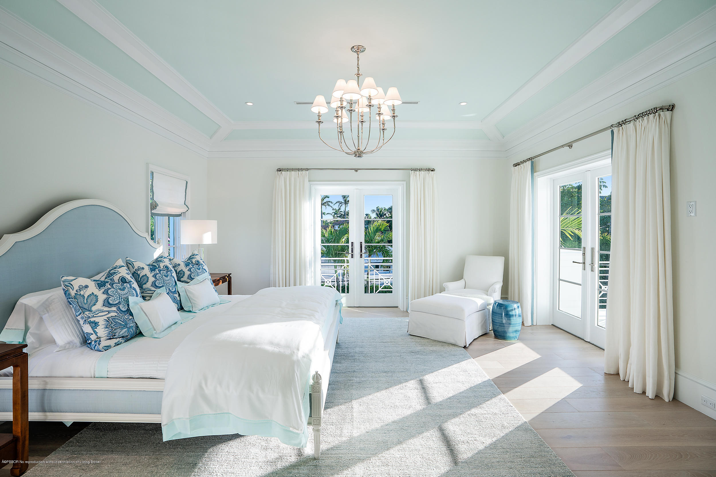 140 Kings Road Palm Beach, FL 33480 - Photo 23 of 42 a bedroom with bed and a chandelier