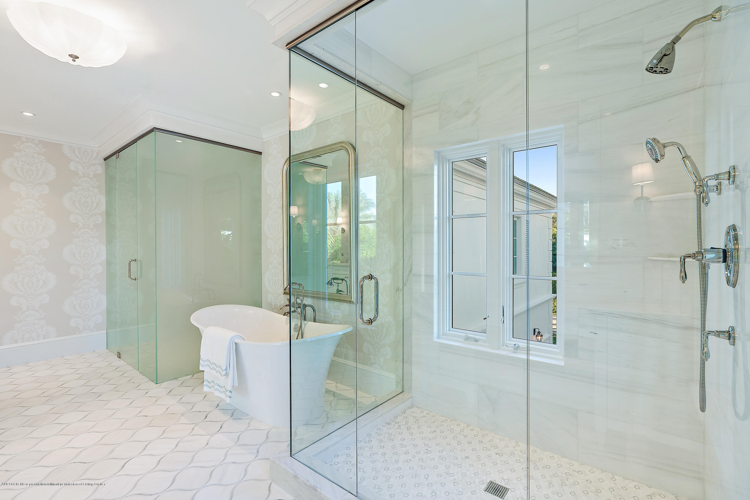 140 Kings Road Palm Beach, FL 33480 - Photo 26 of 42 a bathroom with a shower and a mirror