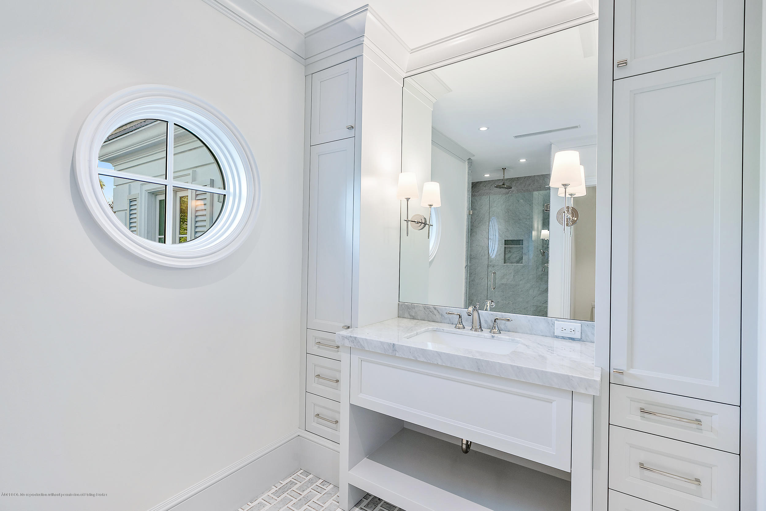 140 Kings Road Palm Beach, FL 33480 - Photo 27 of 42 a bathroom with a sink and a mirror