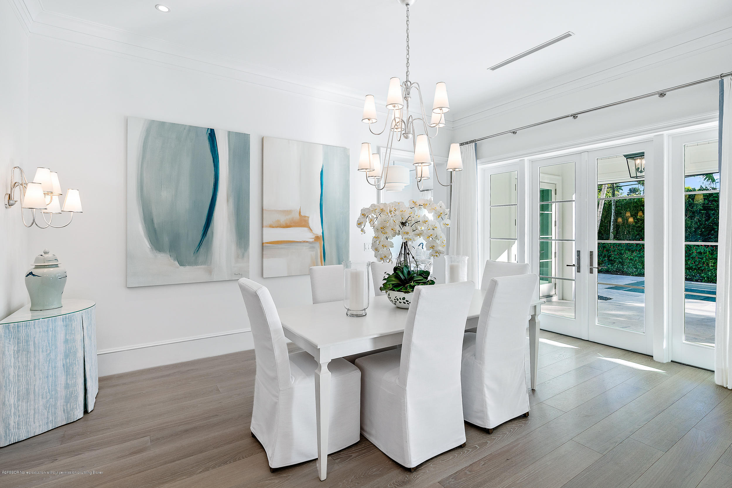 140 Kings Road Palm Beach, FL 33480 - Photo 29 of 42 a view of a dining room with furniture window and wooden floor