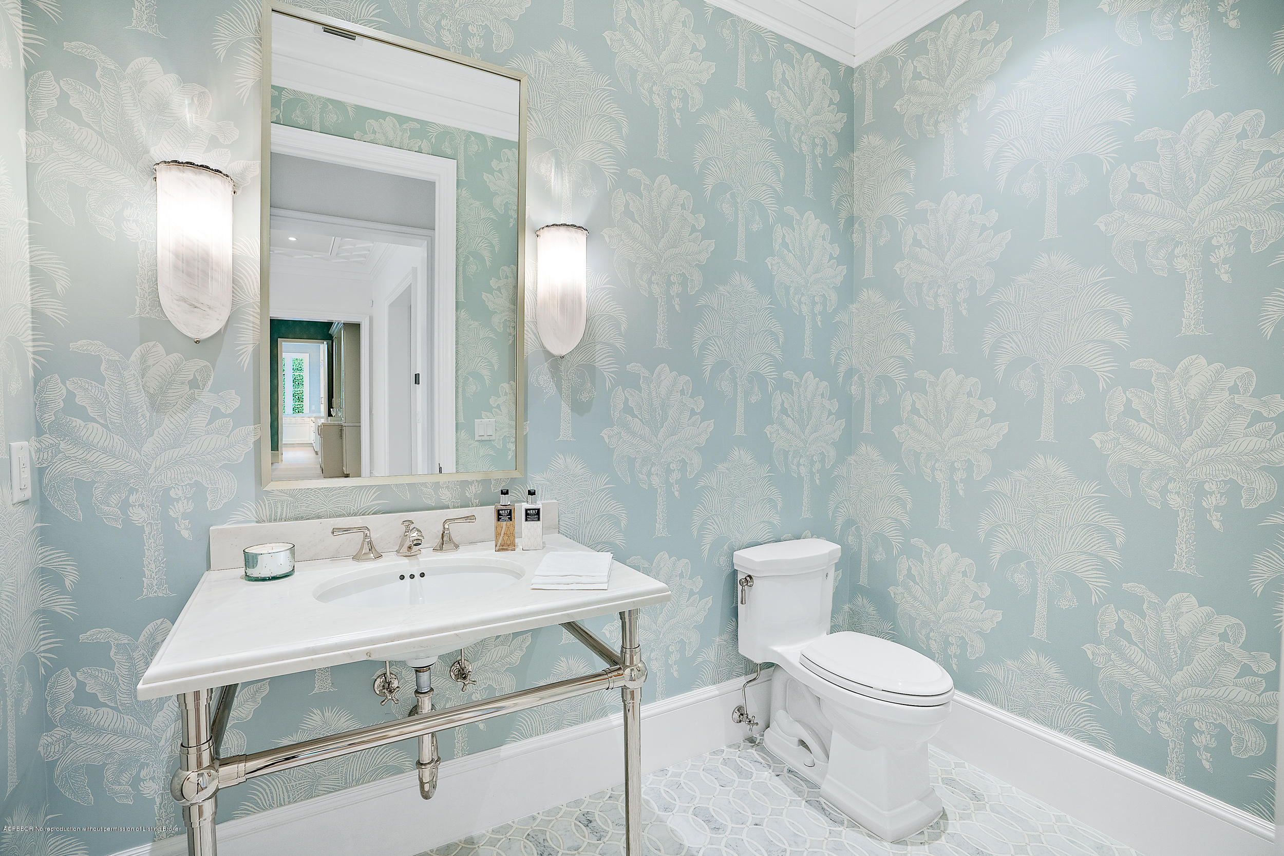 140 Kings Road Palm Beach, FL 33480 - Photo 34 of 42 a bathroom with a sink a toilet and mirror