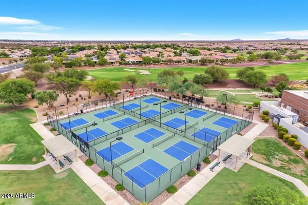 an aerial view of multiple house with yard