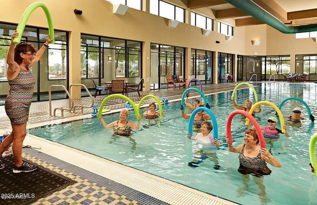 a view of a patio with dining table and chairs
