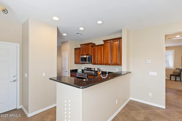 a kitchen with a sink and a refrigerator