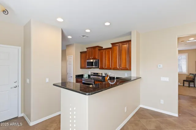 a kitchen with a sink and a refrigerator