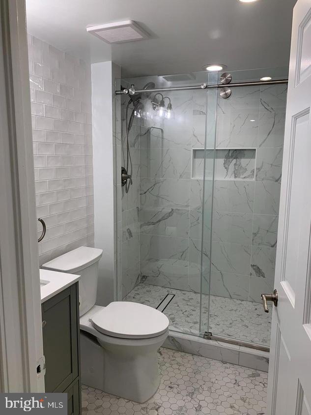 612 C Street Southeast Washington, DC 20003 - Photo 14 of 19 Sleek modern bathroom with elegant finishes.