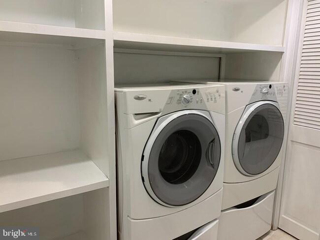 612 C Street Southeast Washington, DC 20003 - Photo 16 of 19 Modern laundry space with sleek appliances.