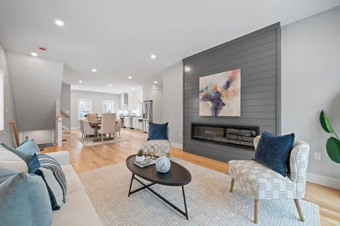 a living room with furniture and a rug