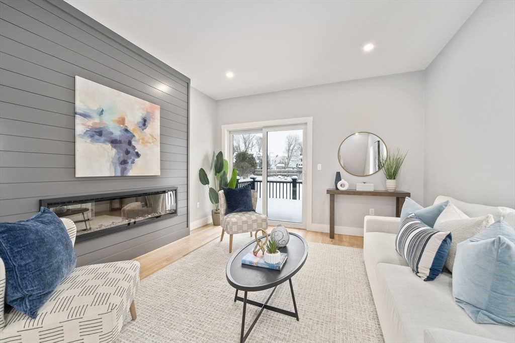 87 Neponset Street, Unit 87 Canton, MA 02021 - Photo 10 of 22 a living room with furniture and a large window