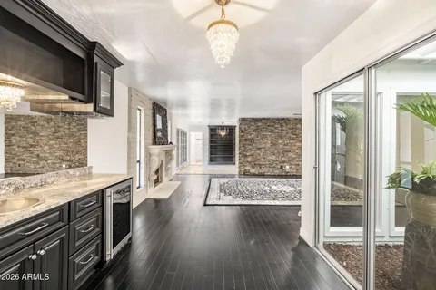 a view of a kitchen with a sink and cabinets