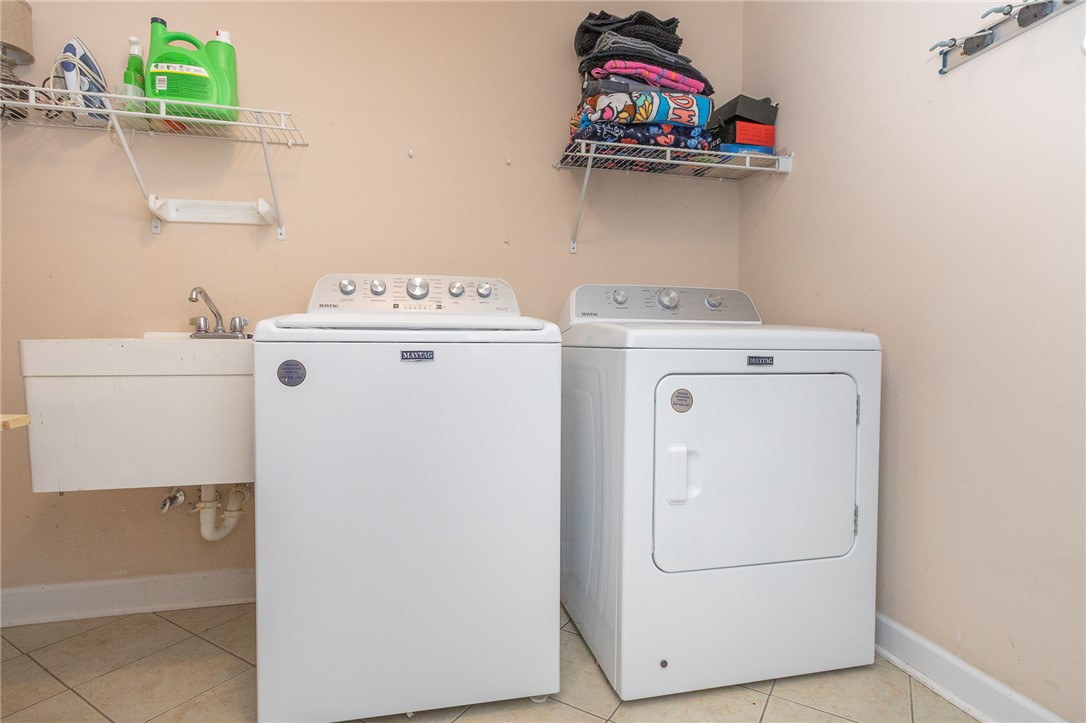 861 North Old Pendleton Road Liberty, SC 29657 - Photo 17 of 45 Functional laundry space featuring a utility sink and essential appliances for daily chores.