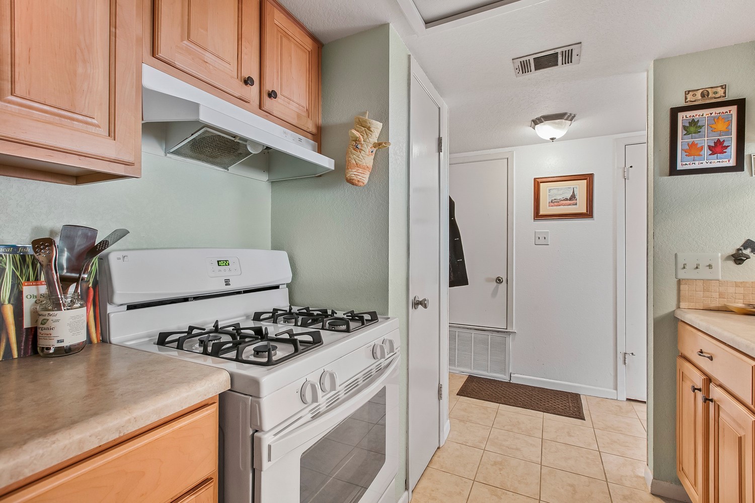 6029 Old Fredericksburg Road, Unit A Austin, TX 78749 - Photo 11 of 20 a kitchen with stainless steel appliances granite countertop a sink stove and refrigerator