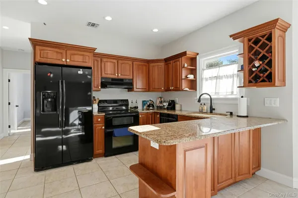 a kitchen with a sink a stove and refrigerator