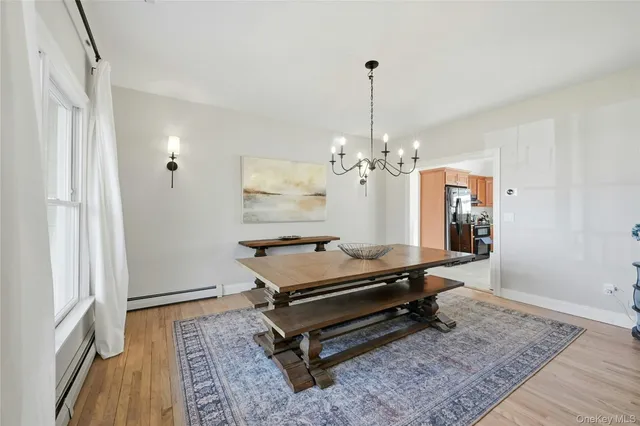 a room with pool table and windows