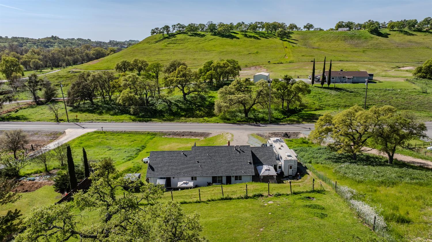 7761 Jenny Lind Road Valley Springs, CA 95252 - Photo 30 of 35 an aerial view of a house with a garden and swimming pool