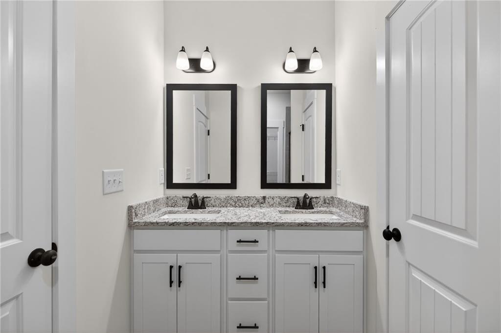 3512-2 Vinson Mountain Road Rockmart, GA 30153 - Photo 32 of 59 a bathroom with a granite countertop sink and a mirror