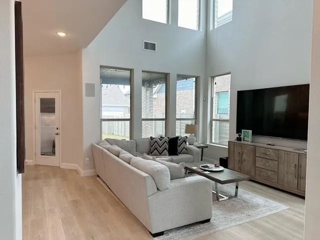 a living room with furniture and a flat screen tv