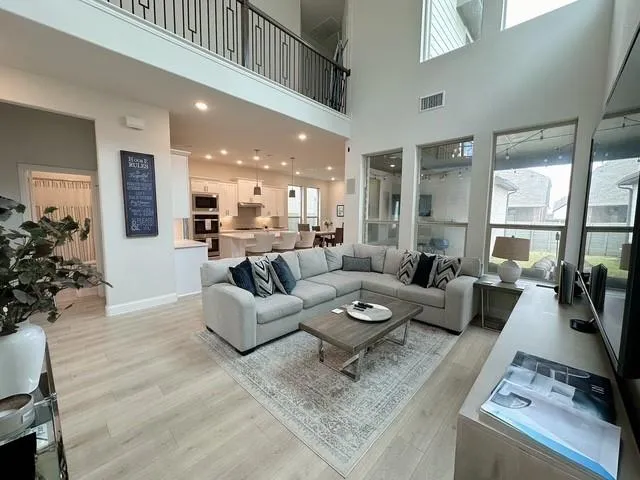 a living room with furniture or couch and a large window