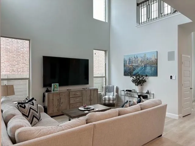 a living room with furniture and a flat screen tv