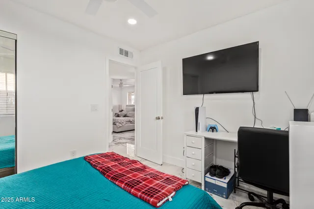 a bedroom with a bed and window