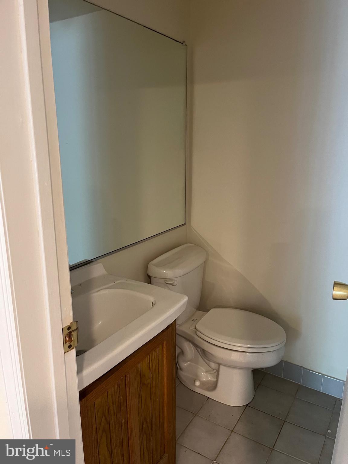20 Lantern Lane Chesterbrook, PA 19087 - Photo 17 of 22 a white toilet sitting next to a white sink and vanity