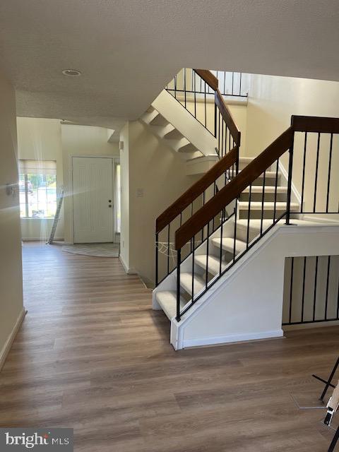20 Lantern Lane Chesterbrook, PA 19087 - Photo 3 of 22 a view of staircase with white walls and wooden floor