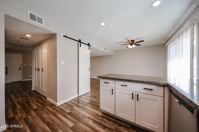 a view of cabinets with wooden floor