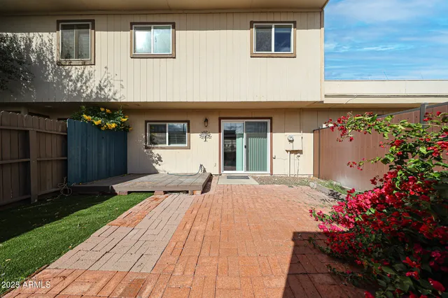 a view of a swimming pool with a patio
