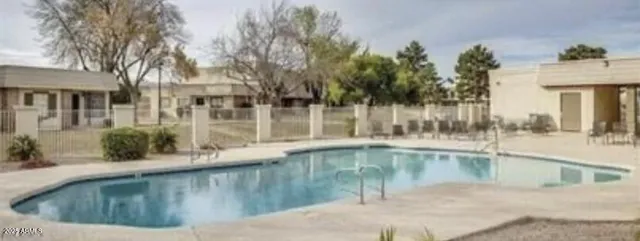 a view of a lake with houses in the background