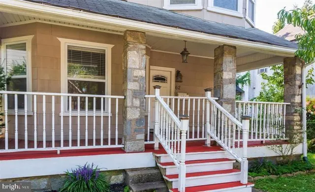 a view of a house with wooden floor and a porch