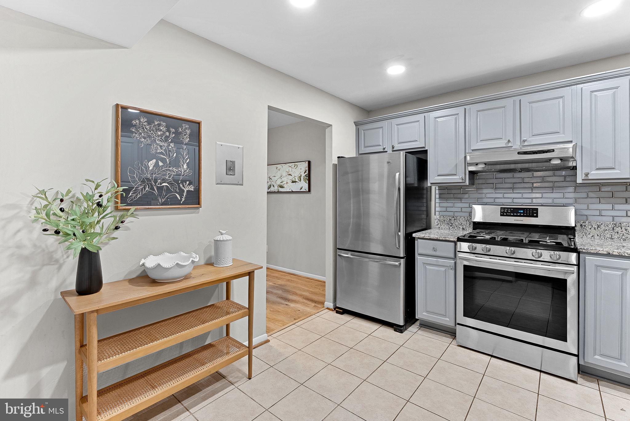 11808 Breton Court, Unit 12C Reston, VA 20191 - Photo 14 of 28 Gourmet Kitchen w/SS appliances and laundry