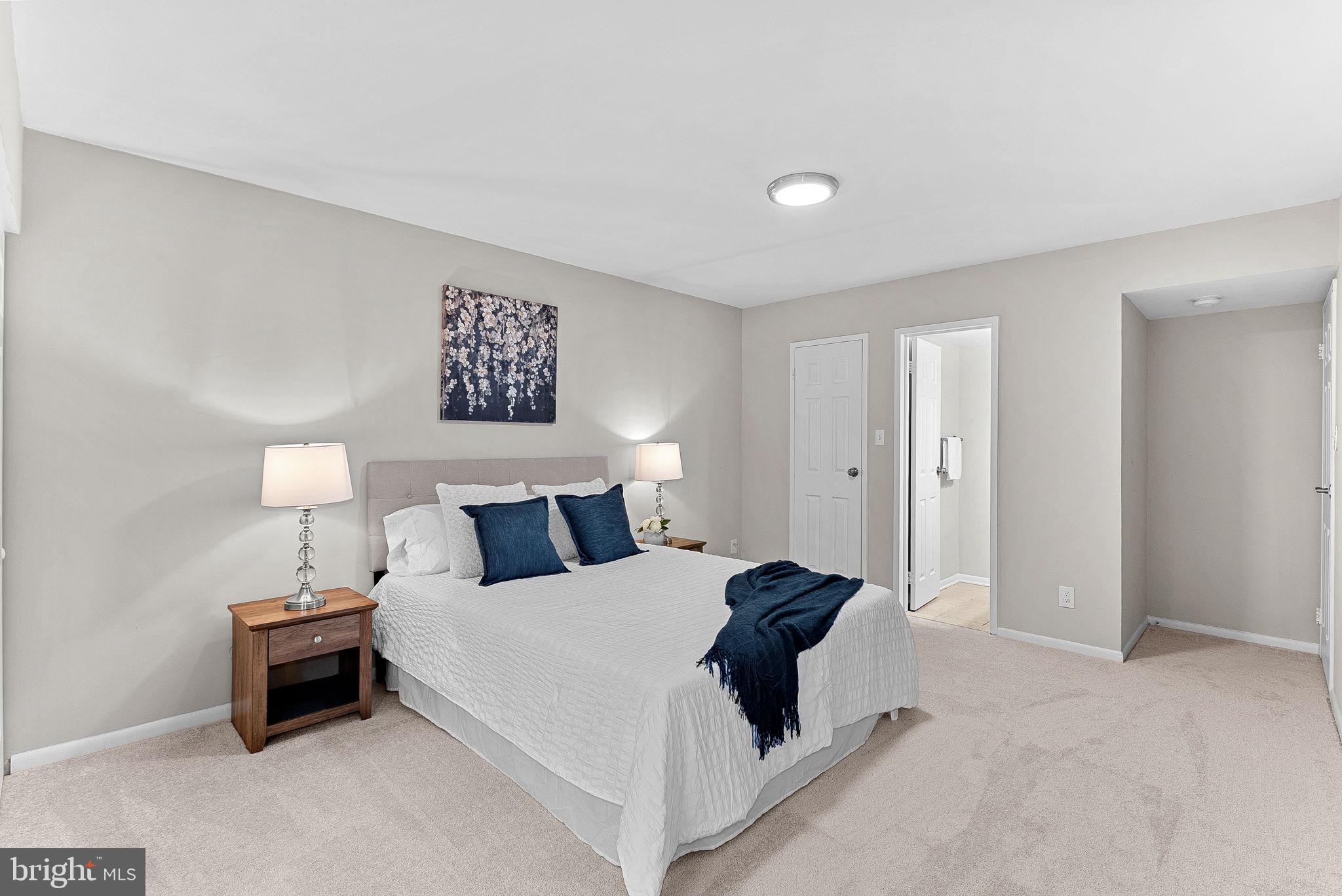 11808 Breton Court, Unit 12C Reston, VA 20191 - Photo 20 of 28 Primary Suite w/half bath and walk-in closet