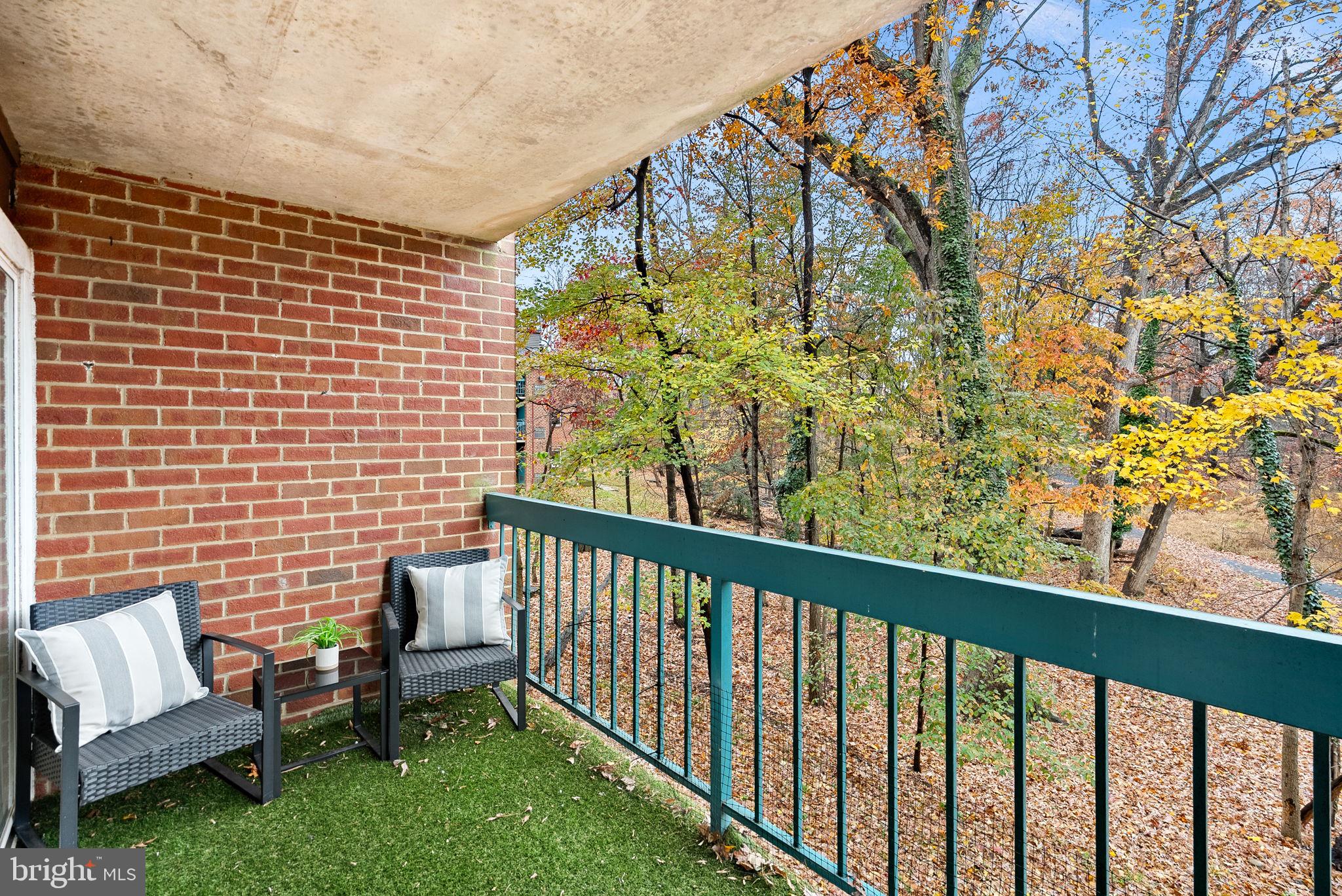 11808 Breton Court, Unit 12C Reston, VA 20191 - Photo 27 of 28 Balcony overlooking woods w/storage