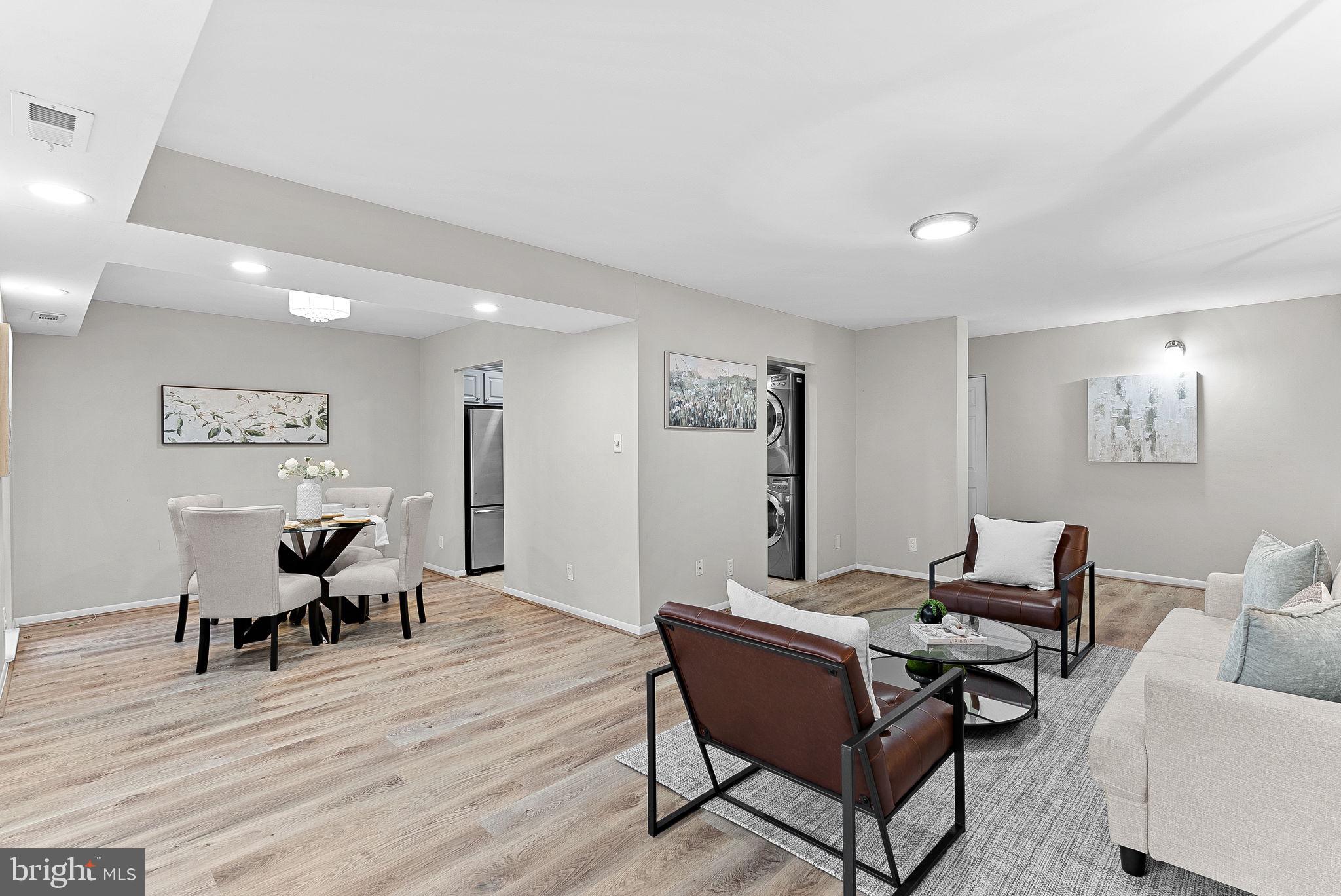 11808 Breton Court, Unit 12C Reston, VA 20191 - Photo 7 of 28 Formal Living Room w/ wooded views