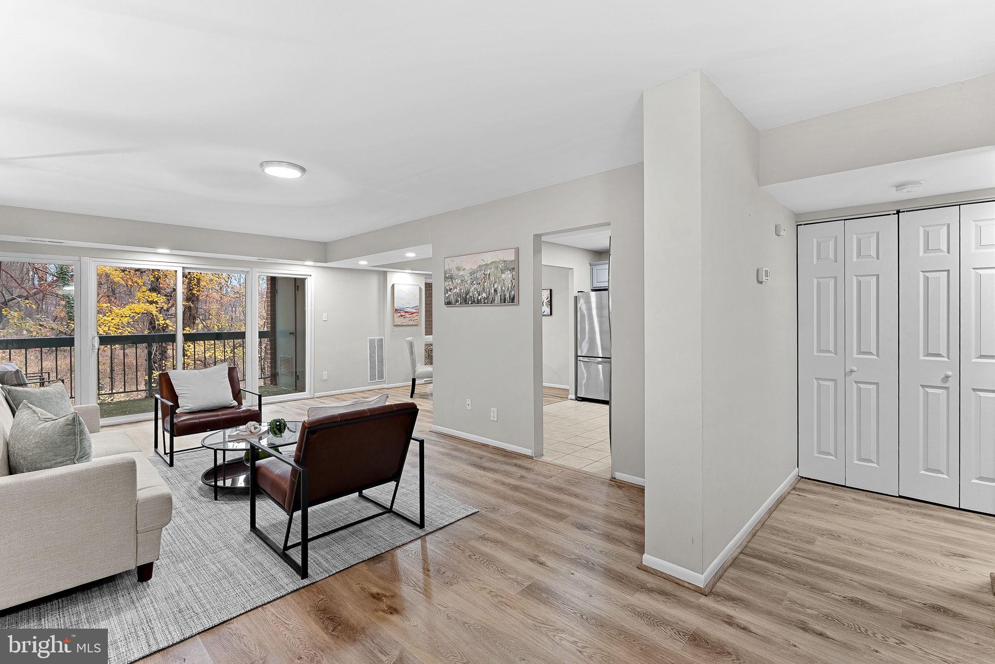 11808 Breton Court, Unit 12C Reston, VA 20191 - Photo 8 of 28 Formal Living Room w/ wooded views