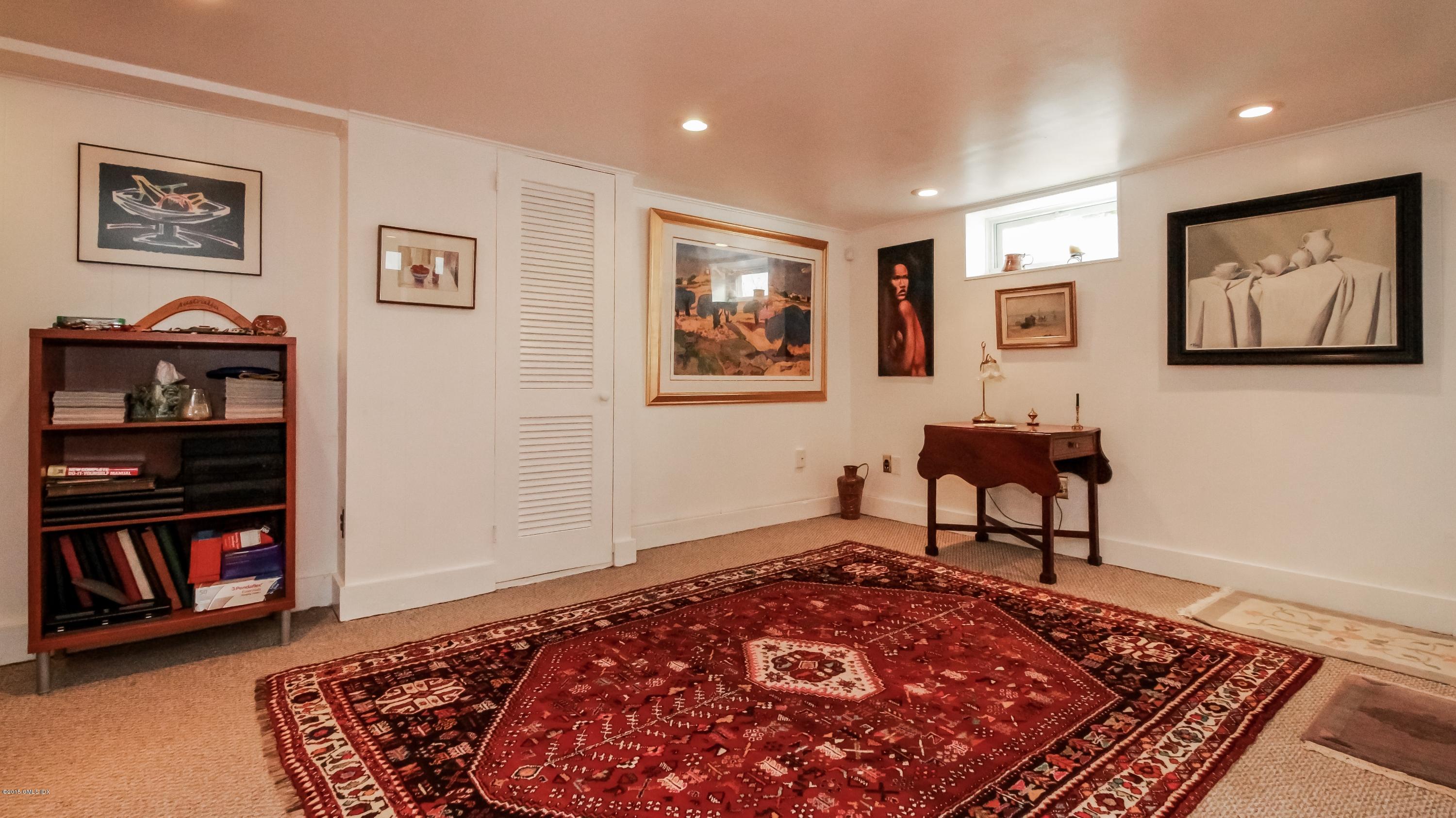 10 Powder Horn Road Norwalk, CT 06850 - Photo 15 of 26 a bedroom with furniture and painting on the wall