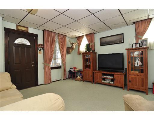1438 Conroy Street McKees Rocks, PA 15136 - Photo 2 of 11 Living Room. Large living room with freshly cleaned carpets