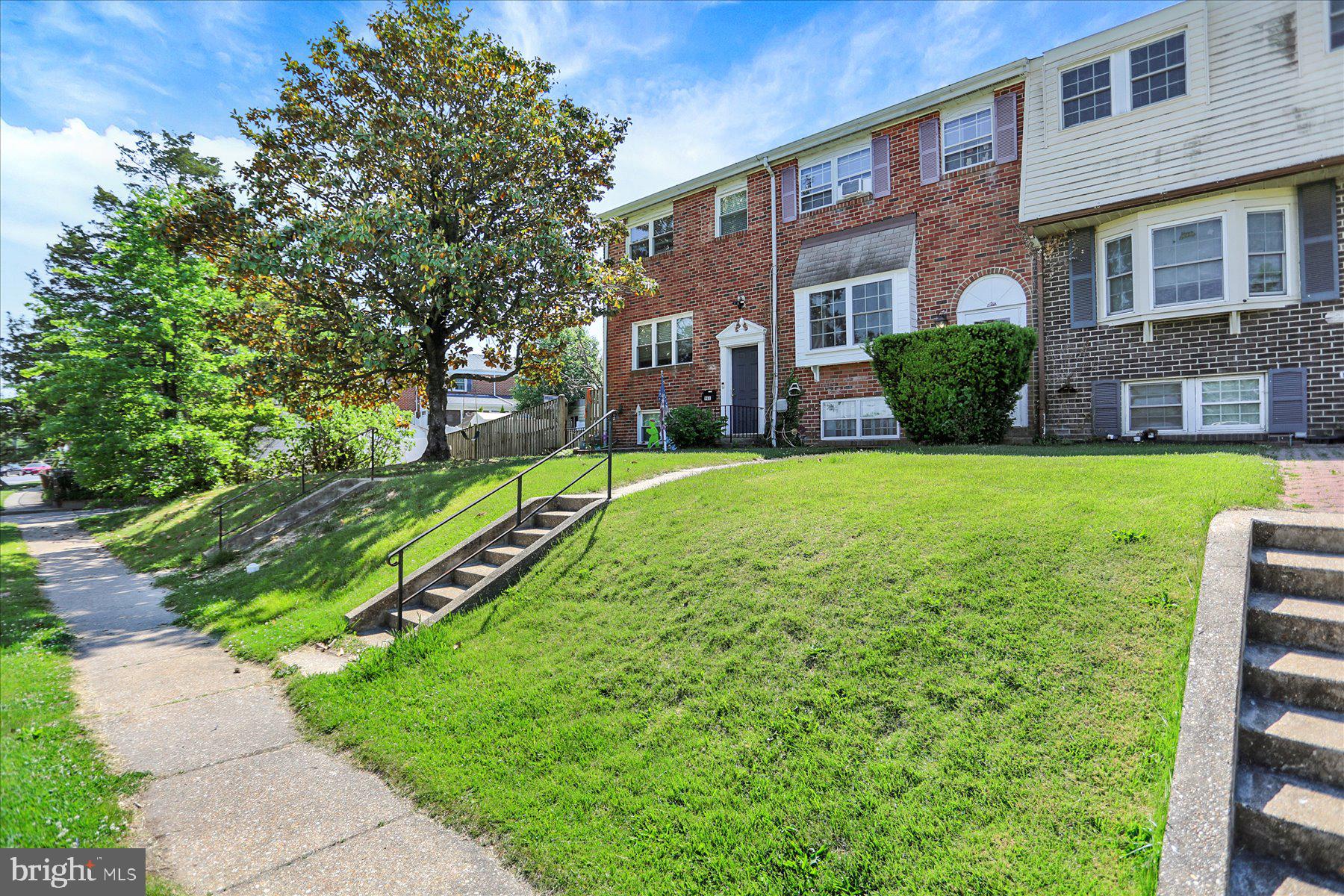 959 Elm Road Baltimore, MD 21227 - Photo 1 of 27 a view of a building with a yard