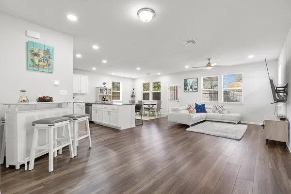 a open kitchen with sink cabinets and wooden floor