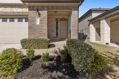 a view of a backyard of the house