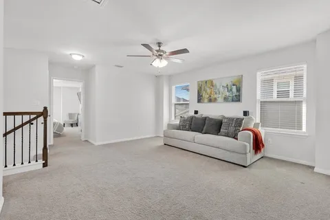 a bathroom with a double vanity sink mirror and toilet