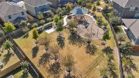 a view of a chairs and tables in the back yard of the house