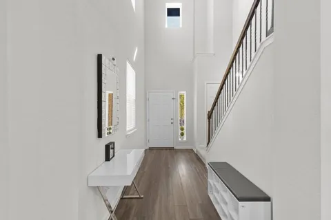 a view of an entryway with wooden floor